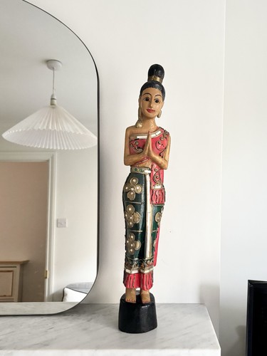 Tall hand carved wooden